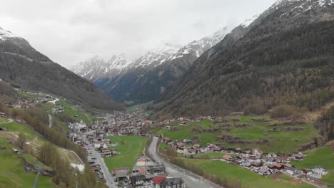 Drone-shot-of-a-small-town-in-the-austrian-alps---Sölden,-Austria