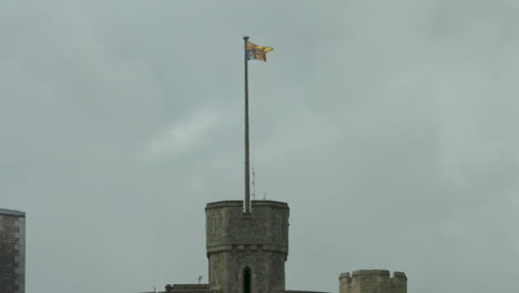 Slow-motion-footage-of-the-Royal-Standard-flag-at-Windsor-Castle-on-a-cloudy,-spring-day