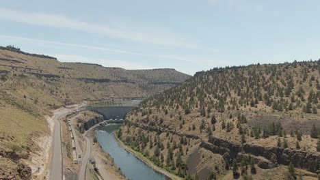 Panoramic-Aerial-View-of-a-Dam-during-a-sunny-summer-day
