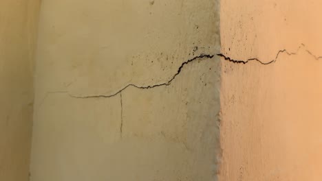 one-large-crack-in-wall-showing-the-crack-in-detail-with-a-corner,-good-video-clip-for-showing-wall-damage-or-home-repairs-needed