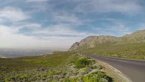 Vehicles-travelling-along-the-Ou-Kaapse-Weg-road-captured-in-a-time-lapse