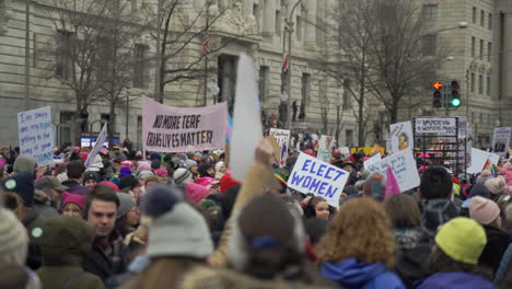 Large-group-of-protesters-with-women's-equality-signs-gathered-on-the-streets-of-Washington-DC-participating-in-the-Women's-March
