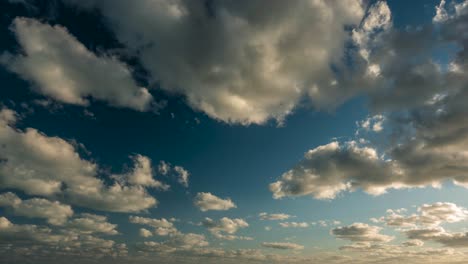 Large-puffy-clouds-after-sunrise-moving-towards-the-camera