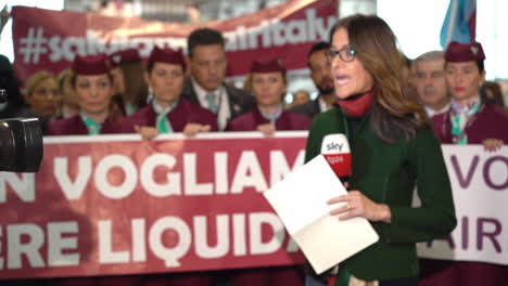Female-Tv-reporter-at-Air-Italy-manifestation-in-airport