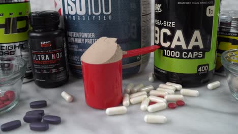 Loose-pills,-powders-and-bottles-of-sports-and-exercise-nutrition-supplements