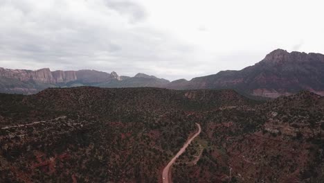 Drone-Aerial-View-on-Hills-and-Mountains-in-Zion-National-Park-Utah-USA-Under-Cloudy-Sky