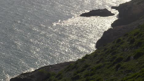 Silver-sea-and-rocky-coast-of-headland,-Spain