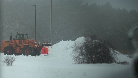 Snow-Plow-Pushing-Heavy-Snow-Pile-in-Winter