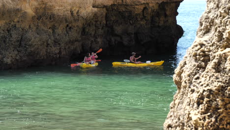 Tourists-sea-kayaking-at-Ponta-da-Piedade-on-sunny-day