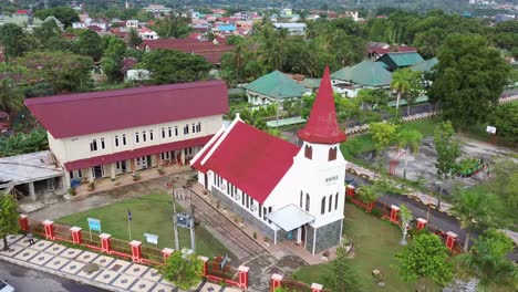 Old-church-at-Palopo-city,-Aerial-over-PNIEL-Palopo-Church