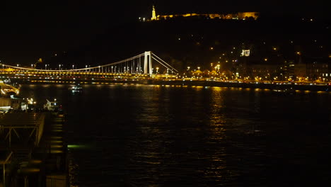 Illuminated-bridge-and-river-Danube-at-night-in-Budapest-Hungary