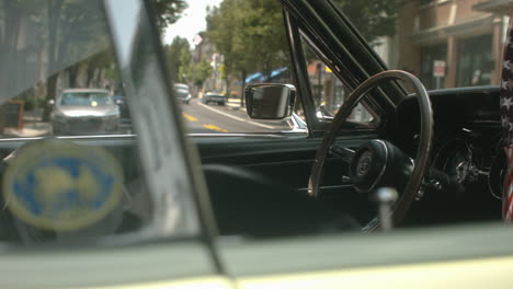 1960s-Ford-Mustang-cockpit-with-American-flag-hanging,-Slide-Right