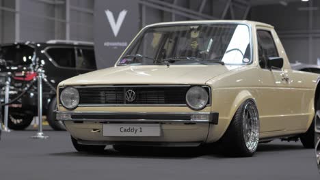 Converted-Old-Gold-Volkswagen-Vintage-Car-Into-Pickup-in-Show-Room-Exhibit