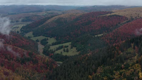 Panoramic-View-Of-Colorful-Forested-Mountain-Ridges-During-Autumn-In-Romania-At-Early-Morning