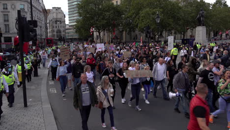 QAnon-Save-Our-Children-protestors-march-through-London-carrying-banners-and-placards-promoting-international-pedophile-ring-and-Coronavirus-conspiracy-theories