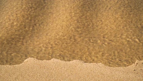 4K-coastal-sand-erosion-on-beach-after-heavy-rain-as-water-carved-her-way-Into-the-ocean