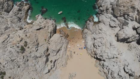 Aerial-View-of-Beach-in-between-Rock-Formations