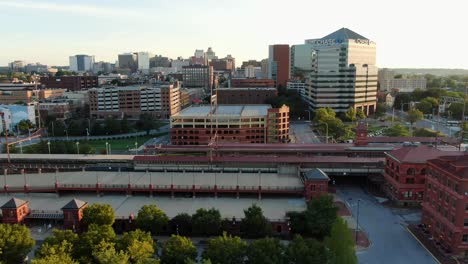 Aerial-truck-shot-of-Wilmington-Delaware-USA-features-Amtrak-train-station,-Chase-Bank,-downtown-urban-skyline