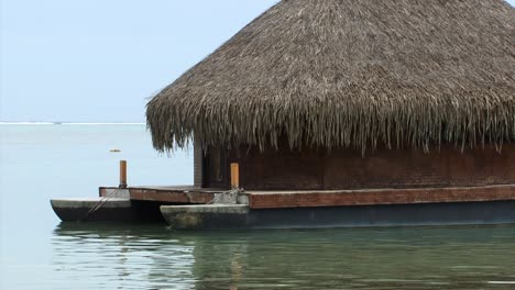 Small-wooden-hut-built-on-a-boat,-Moorea,-French-Polynesia