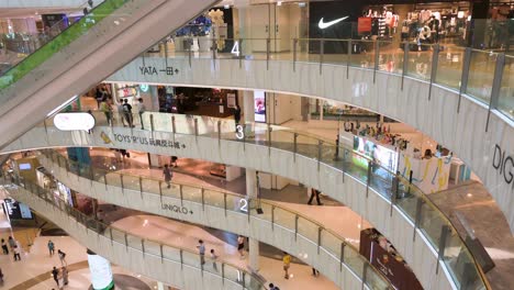 Asian-residents-and-shoppers-window-shopping-and-buy-products-at-a-5-level-floor-high-end-retail-shopping-mall-in-Hong-Kong
