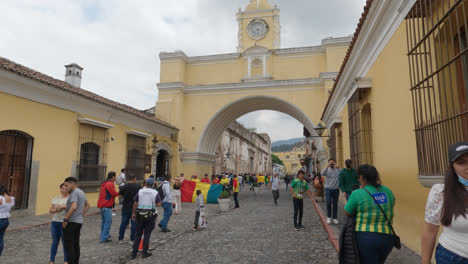 First-Person-POV-Walking-through-Santa-Catalina-Arch-in-Antigua,-Guatemala