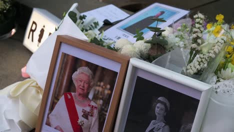 Photographs-of-Queen-Elizabeth-II-next-to-flower-bouquets-are-seen-outside-the-British-Consulate-General-as-a-tribute-after-the-passing-of-the-longest-serving-monarch-Queen-Elizabeth-II
