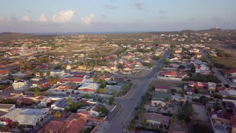 Streets-and-residential-neighbourhood-of-Noord,-Aruba-with-the-blue-sea-in-the-background