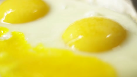 Close-up-of-eggs-frying-in-frying-pan