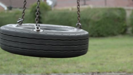 Tyre-swing-swinging-in-park