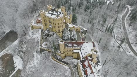 Aerial-View-Of-Hohenschwangau-flying-around-the-castle-poi-in-winter