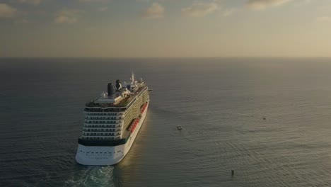 Aerial-view-of-the-cruise-ship-sailing-into-the-big-blue-ocean