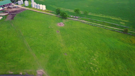 Drone-flying-over-a-large-farm-in-the-countryside