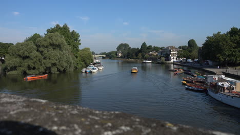 Shot-from-a-bridge-in-Richmond-upon-Thames-of-a-canal-boat-moving-away