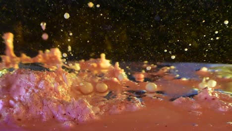 alien-planet-liquid-surface-creating-large-bubble-exploding-to-reveal-milky-smaller-orbs-forming-and-shooting-out-60fps