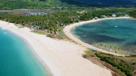 Cinematic-aerial-reveal-of-Double-beach-at-Nacpan-beach,-El-Nido-,-Palawan,-Philippines