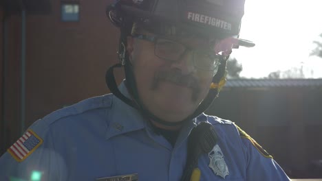 Firefighter-motion-portrait-in-early-morning-sunlight-ready-to-respond-to-emergencies-at-a-fire-department