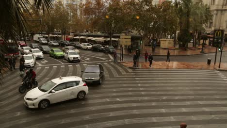 Time-Lapse-of-busy-European-city-intersection-during-gloomy-autumn-with-congestion-and-many-pedestrians