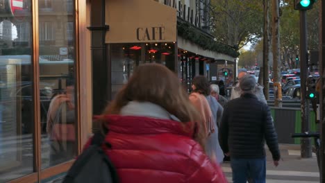 Nov-2019,-Paris,-France:-people-walking-besides-a-small-café-in-the-center-of-Paris