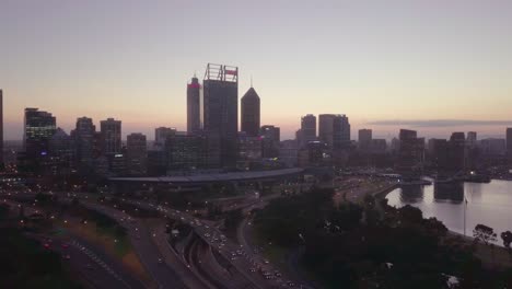 Aerial-dolly-motion-view-of-a-Perth-Skyline-as-seen-from-the-Swan-River,-moments-before-the-Sunrise