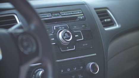 Pressing-the-power-button-to-turn-on-the-CD-player-on-a-car-radio