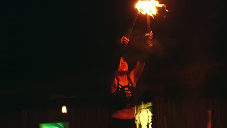 Fire-show-or-Thumbuakar-performance-at-night-safari,-Singapore