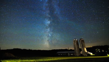 Milky-Way-Time-Lapse-Sliding-Over-Farm-Silos-and-Field