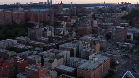 Aerial-flight-over-the-Manhattanville-part-of-Harlem,-NYC,-smooth-turning-towards-Morningside-Park,-at-daybreak