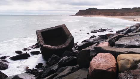 Medium-floating-shot-of-the-bunker-from-the-top-of-the-rocks-at-Montauk-Point-beach