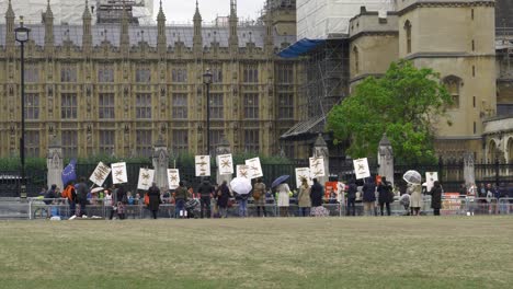 View-behind-a-group-of-Christians-protesting-against-RSE-Statutory-in-English-schools-from-2020-outside-UK-Parliament-4K60fps