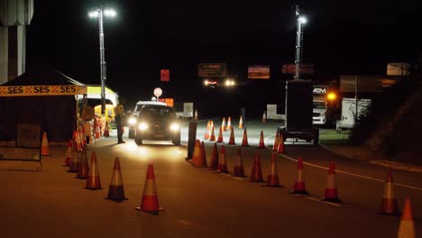 Night-traffic-checkpoint---Australian-highway-exit---wide-shot