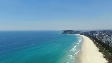 Slow-rise-upwards--drone-footage---beautiful-view-of-Burleigh-Heads---Coastal-living-on-the-Gold-Coast,Queensland-Australia