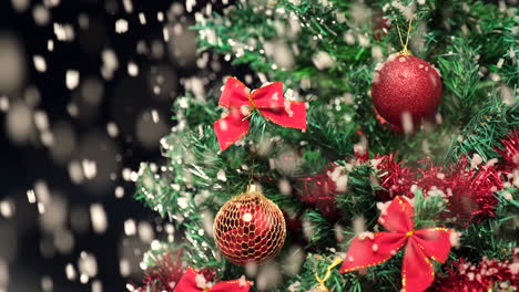 Christmas-snow-falling-on-tree-decoration-at-winter-night