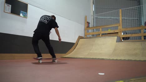 Male-skater-making-360-flip-on-skateboard