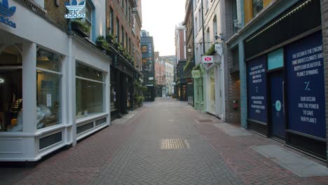 Lockdown-in-London,-closed-and-shuttered-retail-shops-on-empty-Carnaby-Street,-Soho,-during-the-COVID-19-pandemic-2020